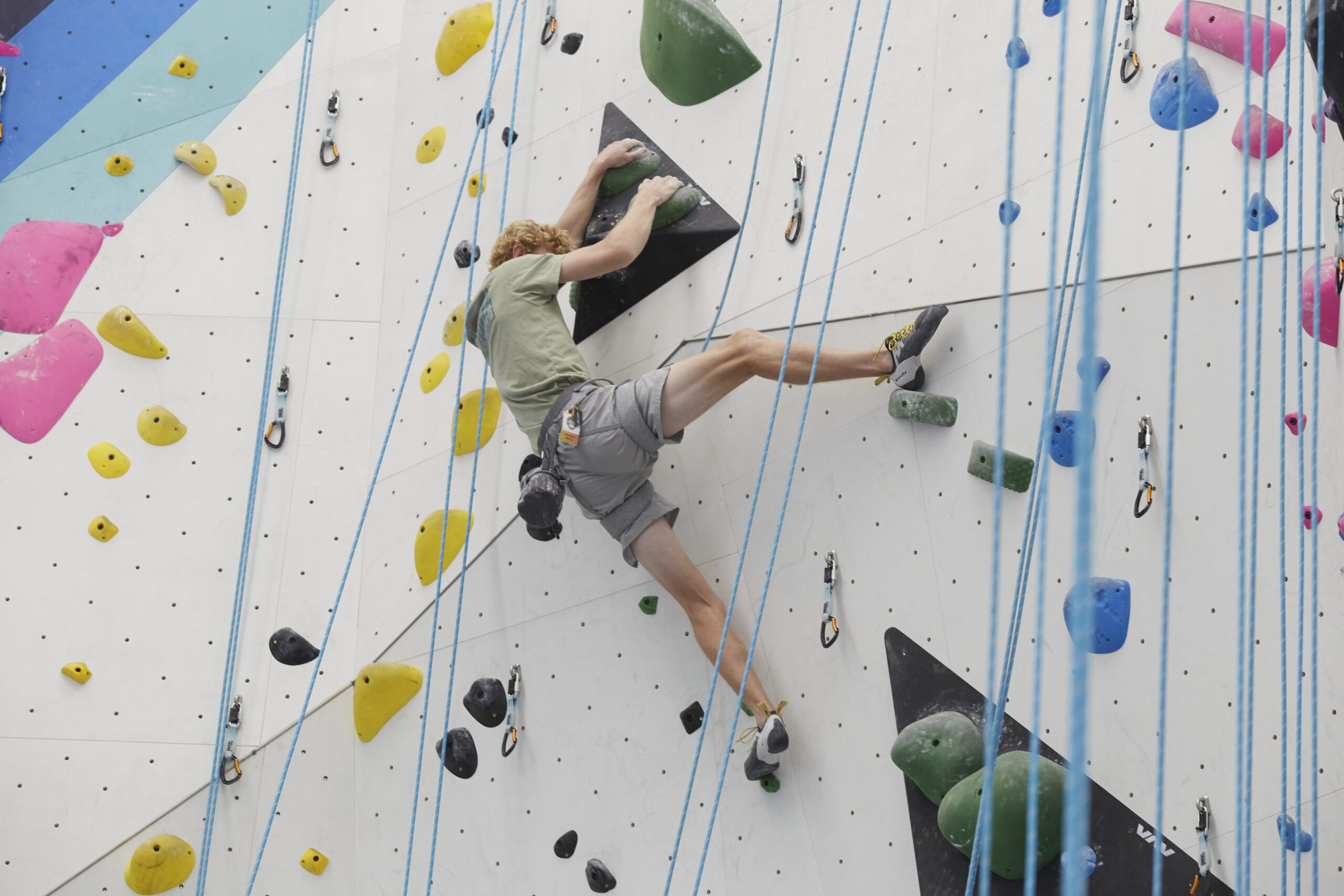 a climber using good footwork at Velocity Climbing Miami